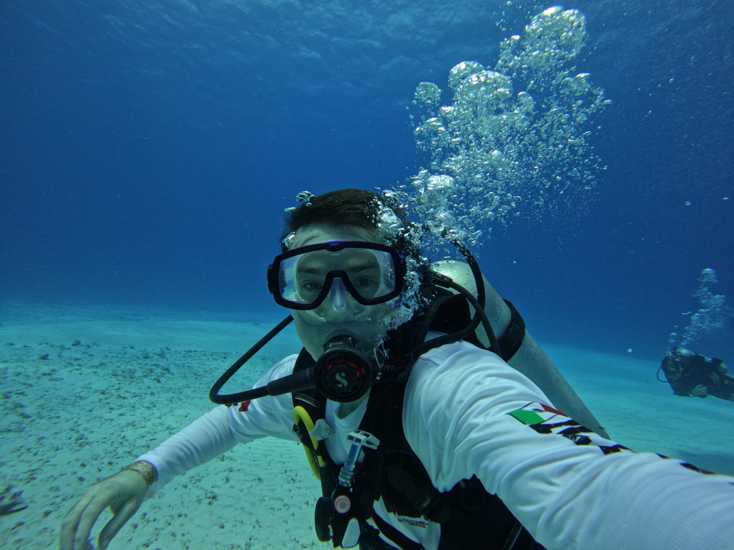 Scuba-Diving-Cozumel An image of a scuba diver with outstanding visibility.