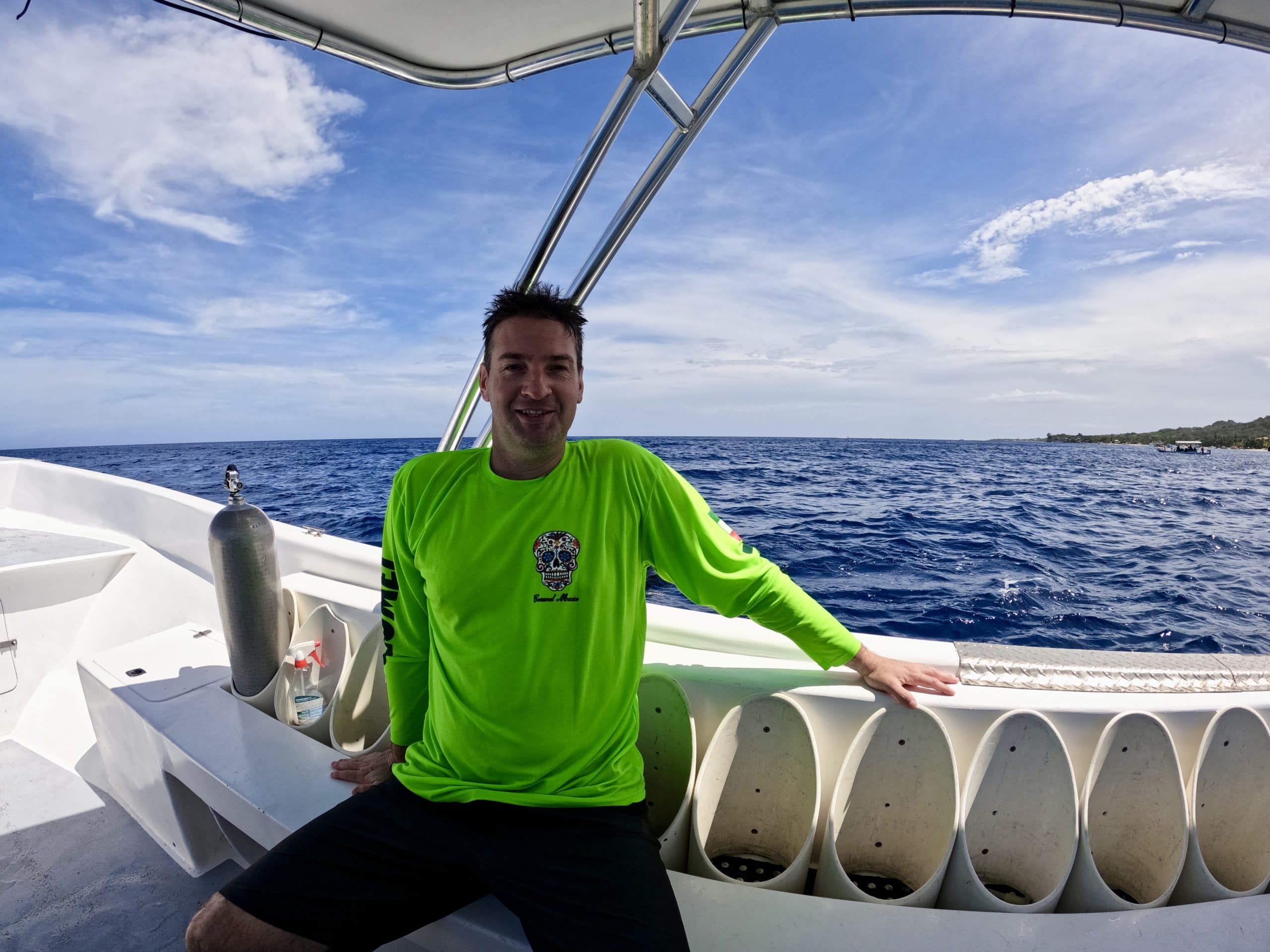 Scuba diver on a boat after a dive in Roatan, Honduras.