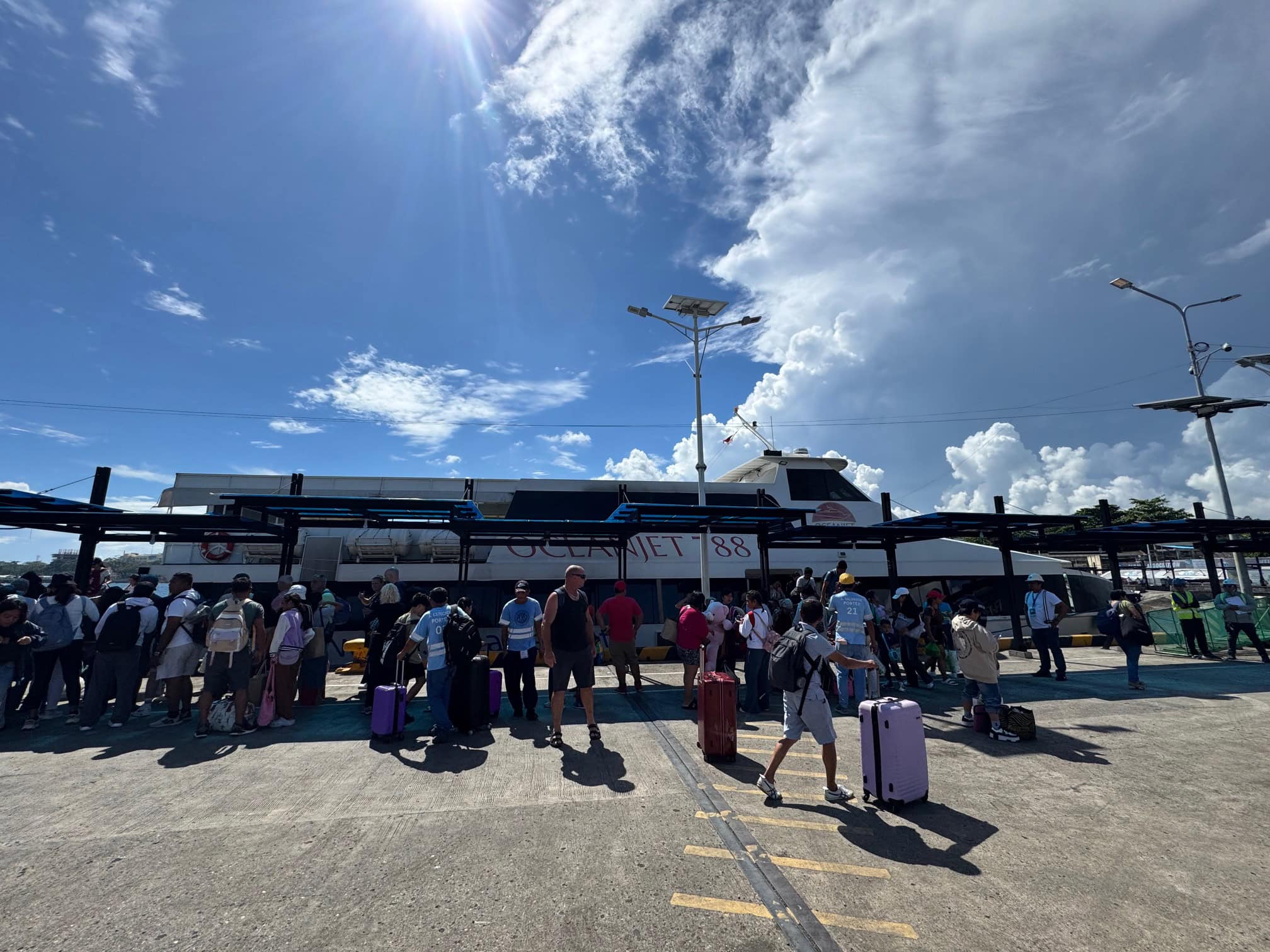Travelers disembarking from the ferry in Bohol after a 2 hour journey from Cebu.
