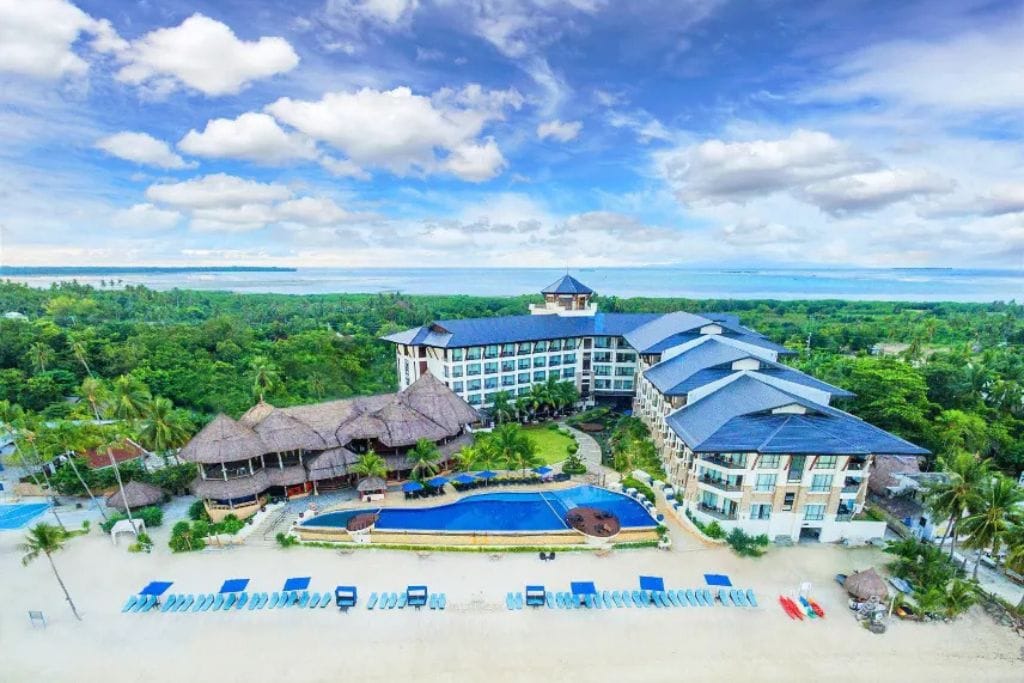 Bellevue Resort pool and beach: The Bellevue Resort in Panglao is ideal for families and couples seeking privacy, comfort, and kid-friendly amenities