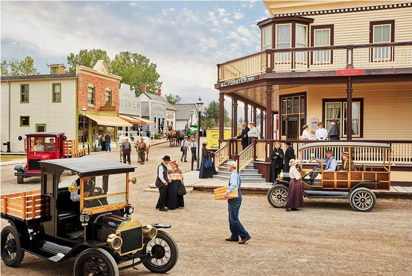 Historic buildings and vintage cars at Heritage Park Historical Village, Calgary’s living history museum.