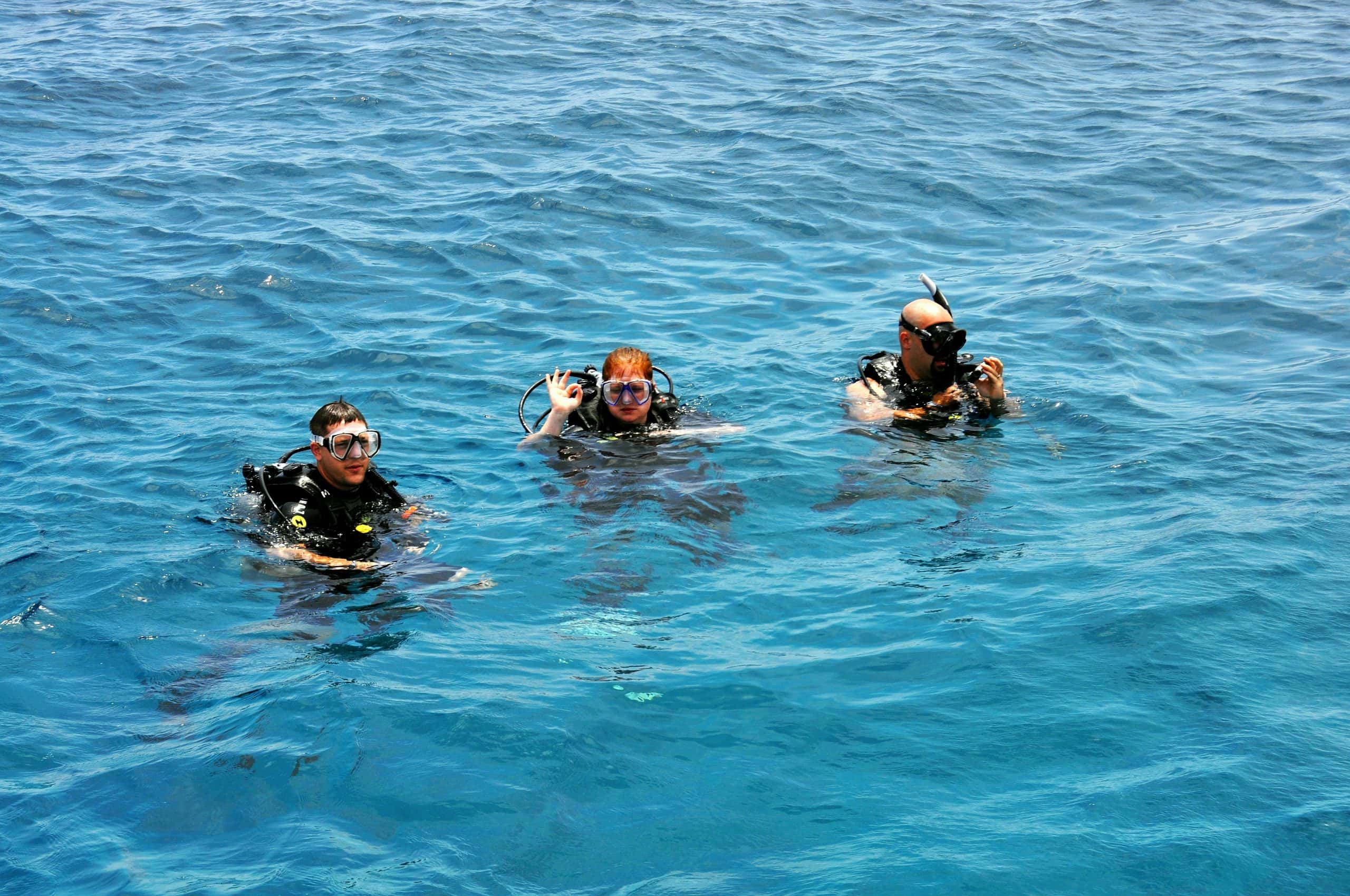 New scuba diver practicing buoyancy control during an open water dive session in the Philippines.