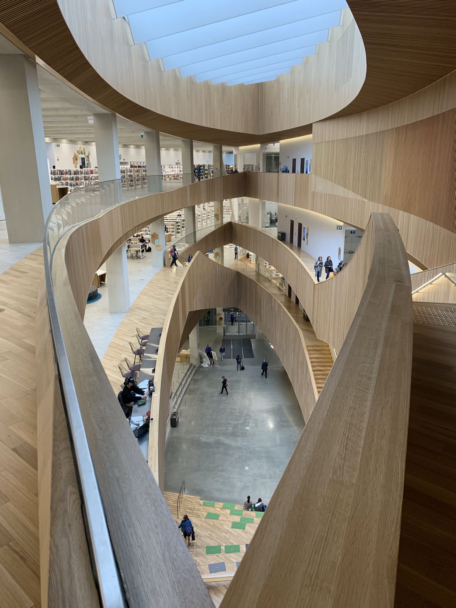 Interior of the Calgary Central Library with stunning modern wooden architecture.