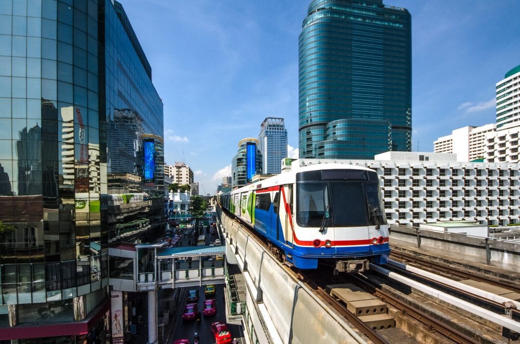 Bangkok skytrain traveling along elevated tracks through the city