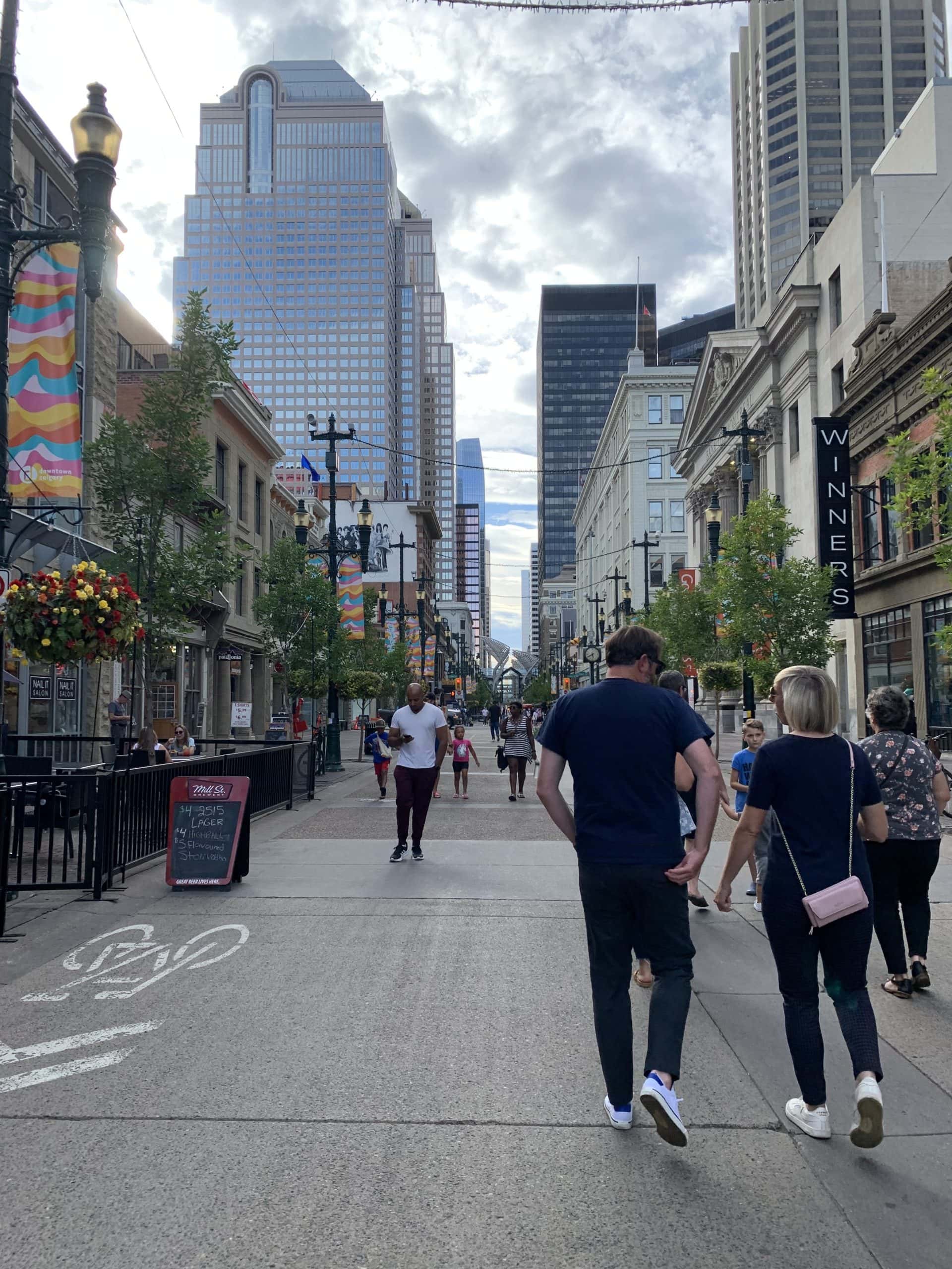 Pedestrian-friendly Stephen Avenue filled with shops, cafes, and historic architecture.