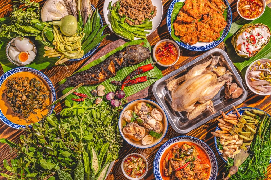 Traditional Thai street food dish with colorful ingredients on display
