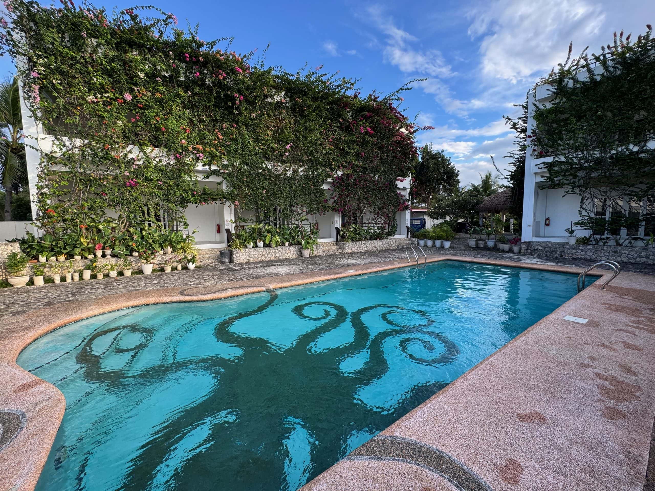 Chill pool area surrounded by palm trees, perfect for relaxing on the final day of your itinerary.