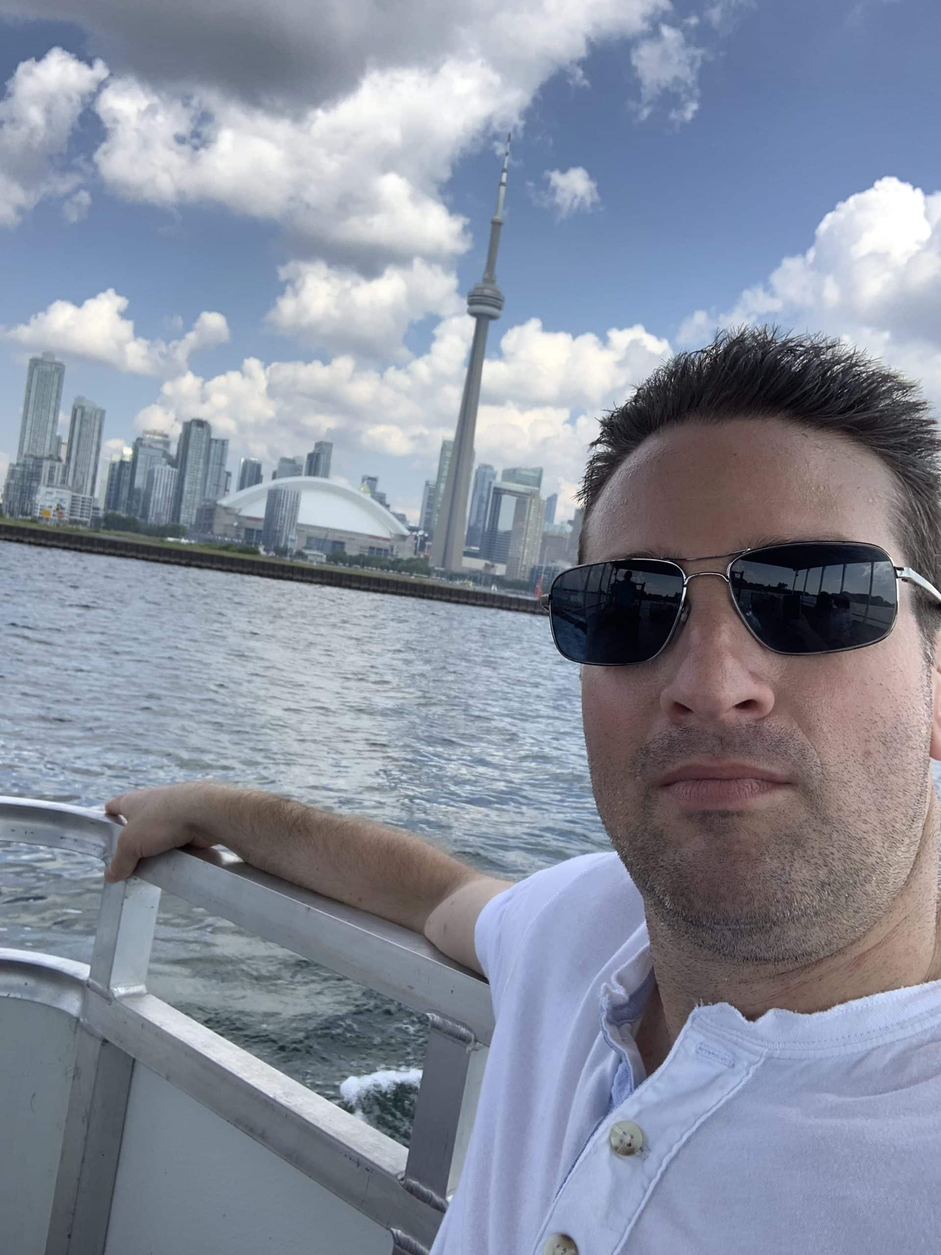 scenic view of downtown Toronto from Lake Ontario and ferry heading to the Toronto Islands