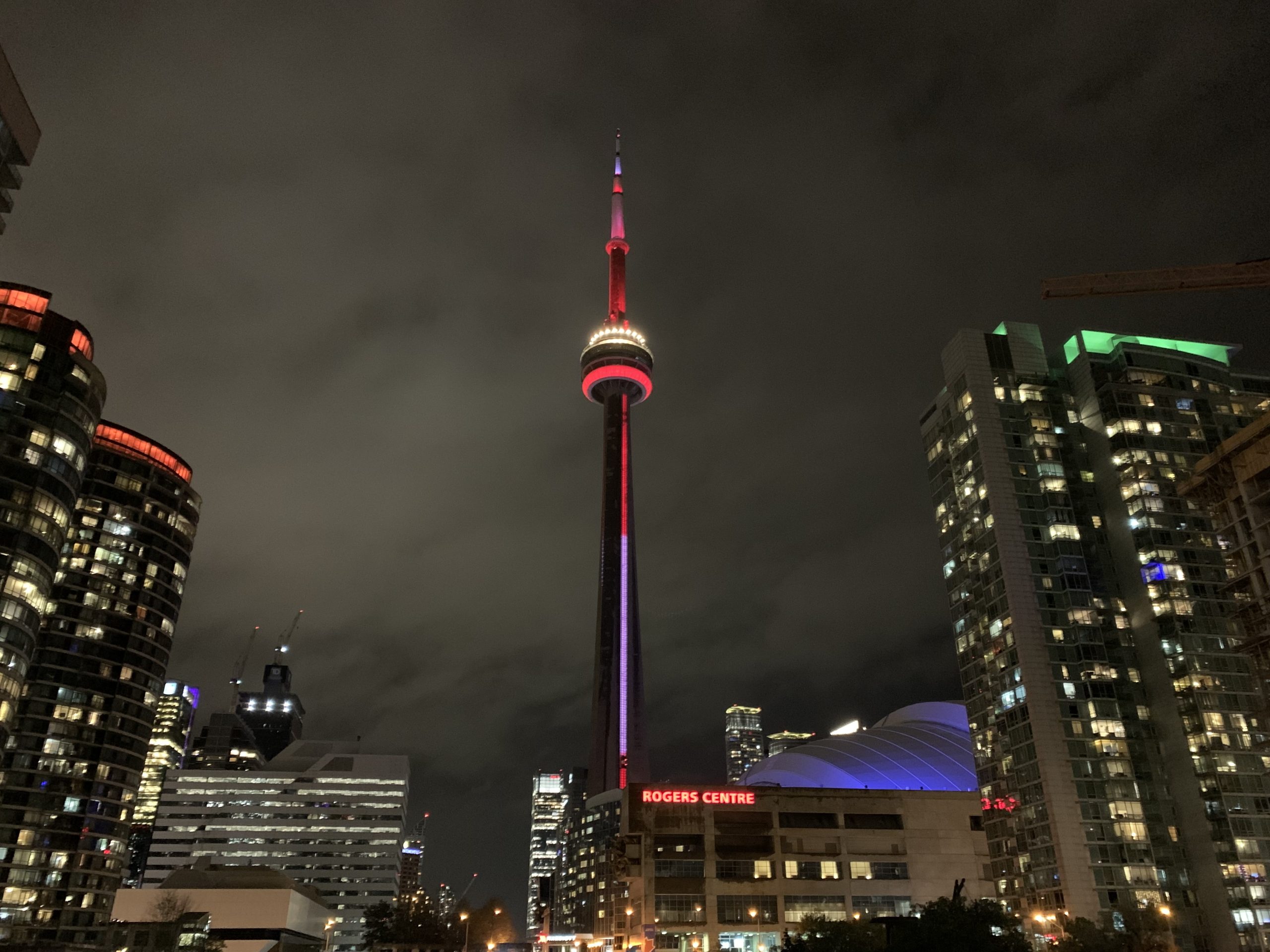 panoramic view of the CN Tower rising above downtown Toronto.