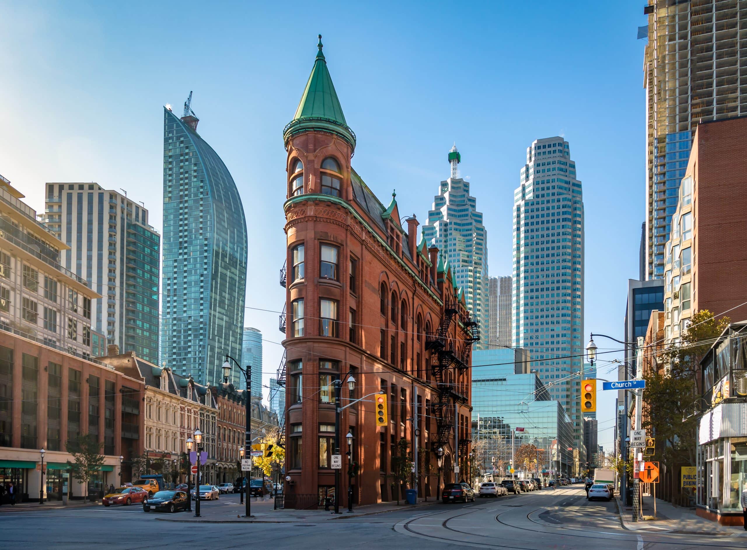 iconic red brick Flatiron-style Gooderham Building at the intersection of Front and Church Streets