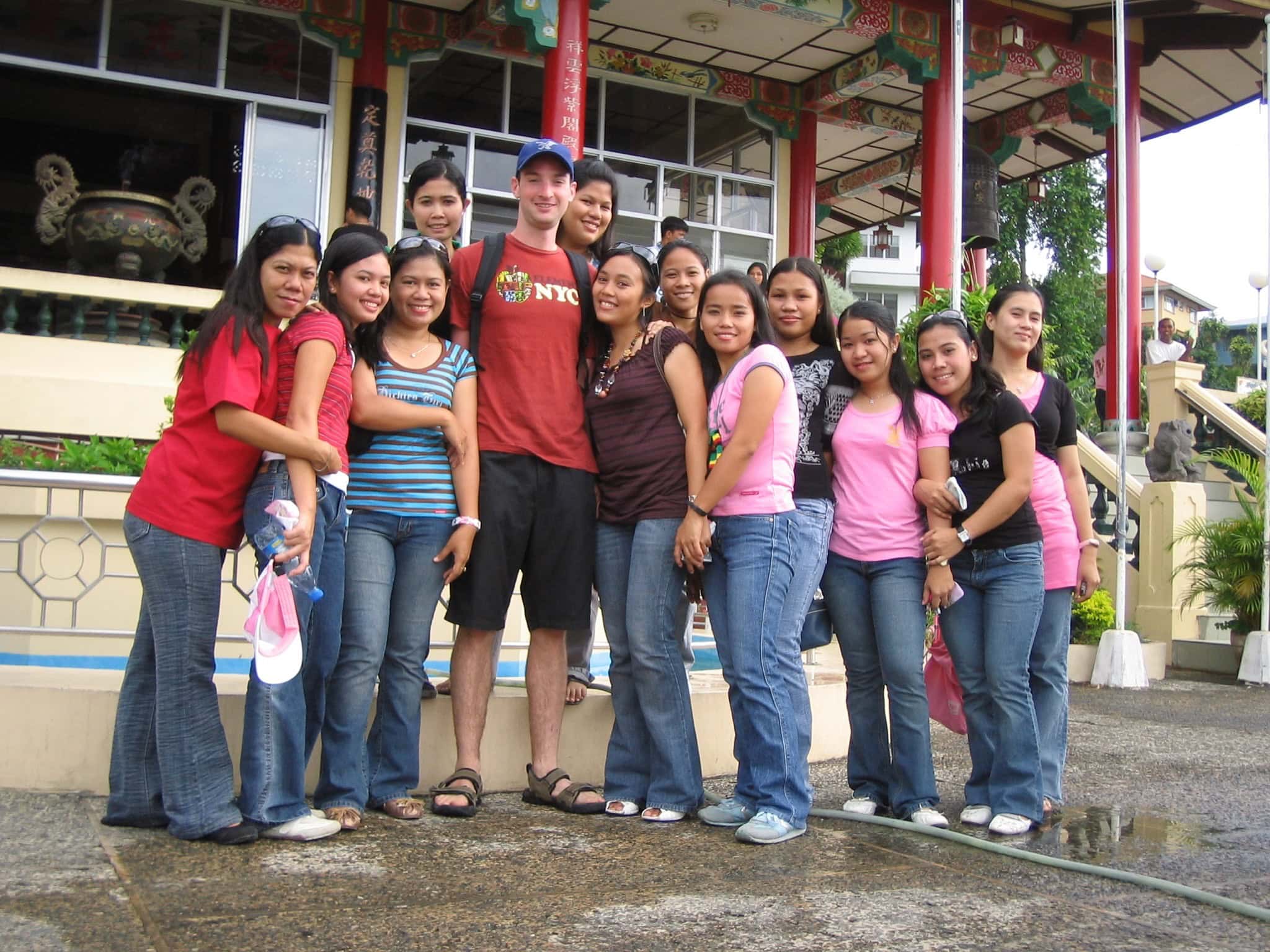 A group photo taken at Cebu’s Taoist Temple, featuring friends and visitors gathered together in front of the temple’s colourful entrance with its traditional Chinese design.