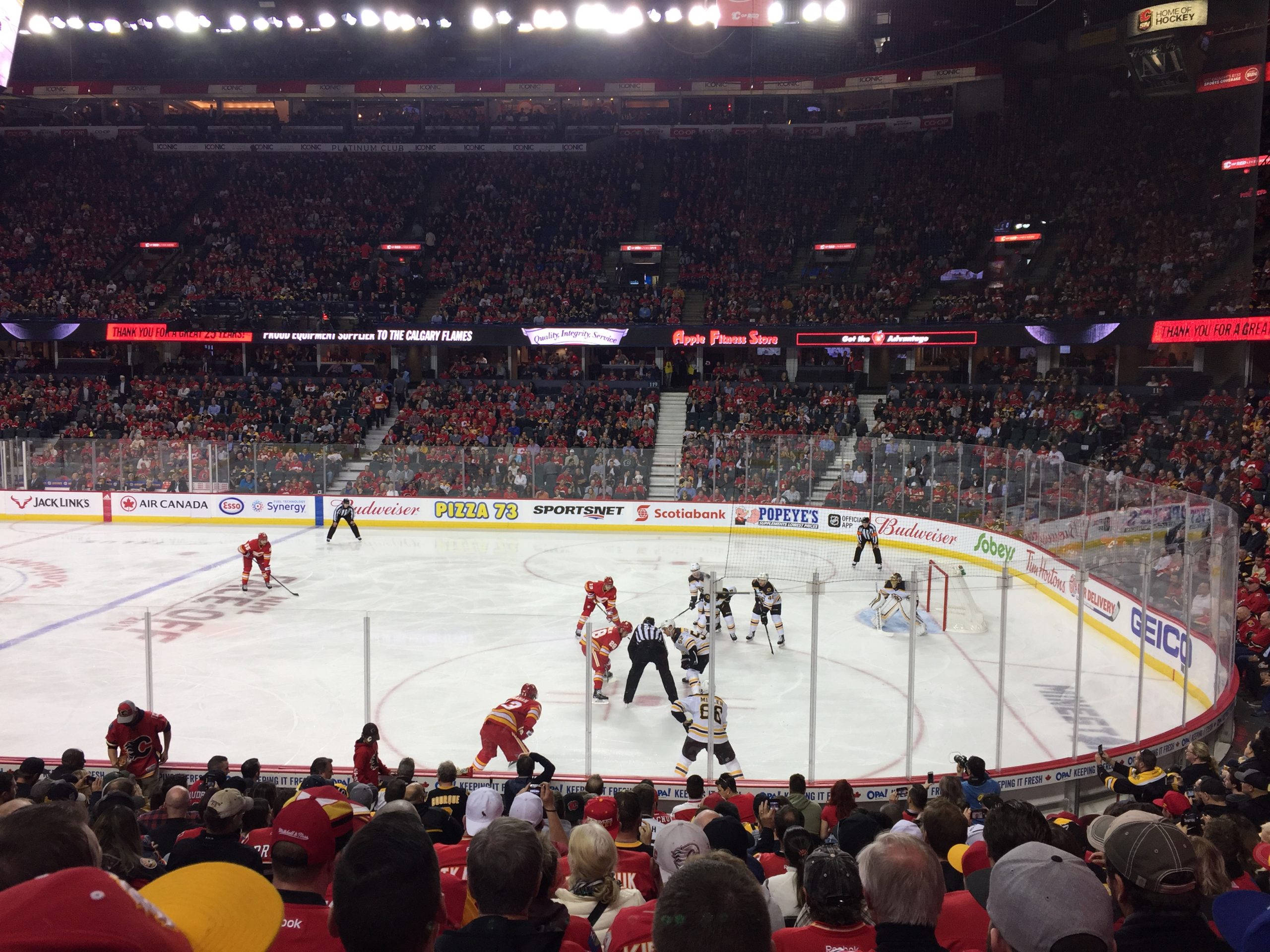 Fans pack the Scotiabank Saddledome in Calgary to watch the Flames face off against the Boston Bruins, filling the arena with energy and excitement on game night.