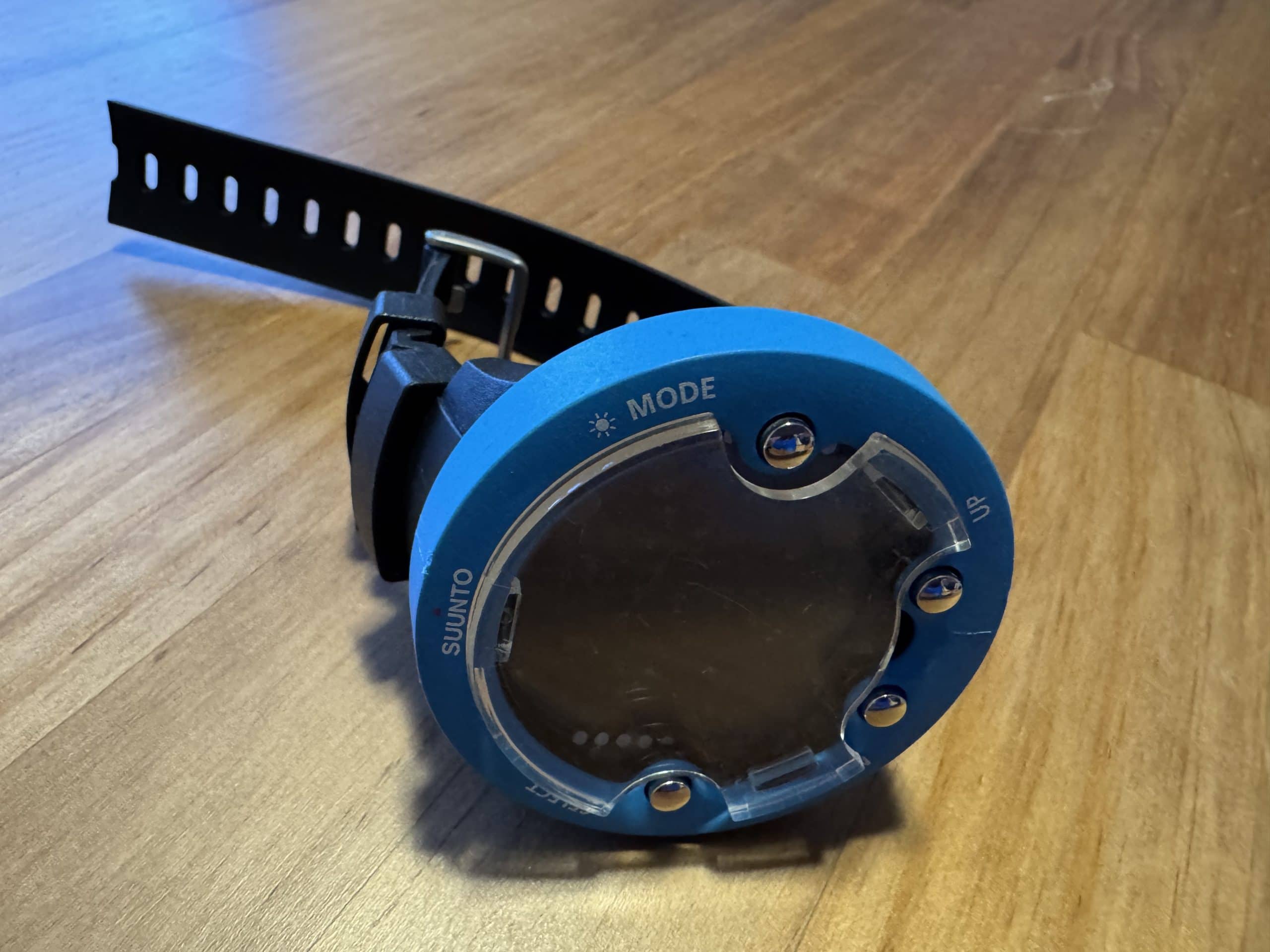 Suunto dive computer used for scuba diving to track depth, time, and decompression during underwater dives.
