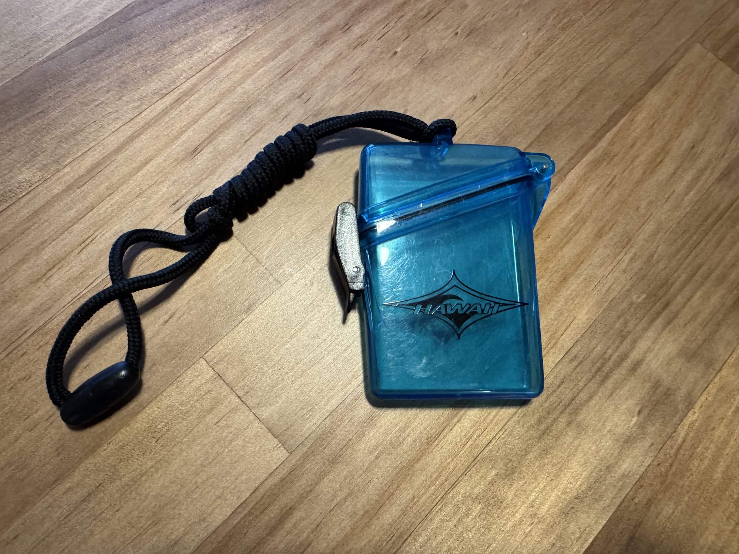 Waterproof phone pouch with lanyard used for beach trips, snorkelling, and boat tours to keep your phone safe and dry.