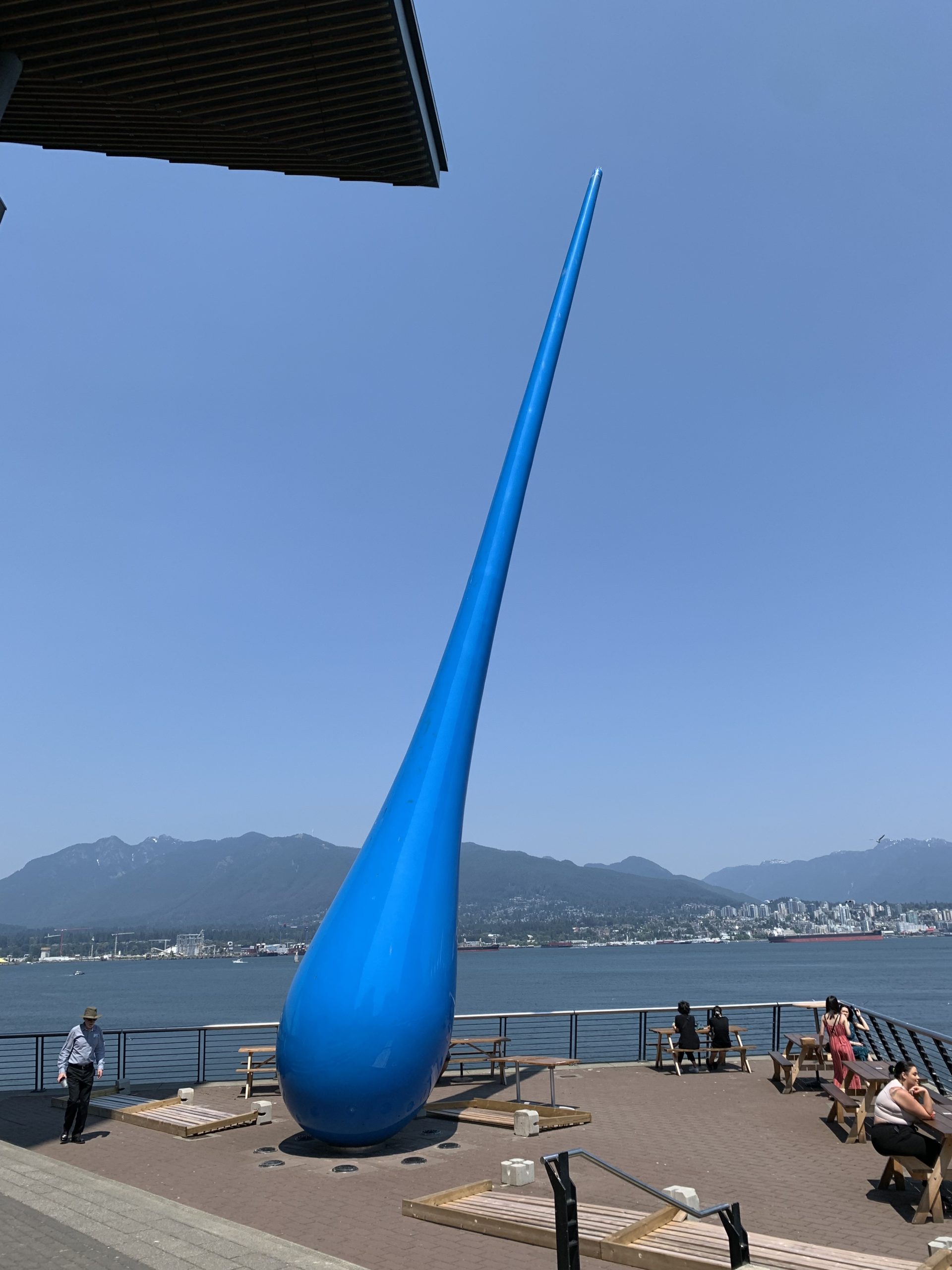 Blue Drop sculpture at Vancouver Convention Centre with Burrard Inlet, North Shore Mountains, and waterfront views in downtown Vancouver