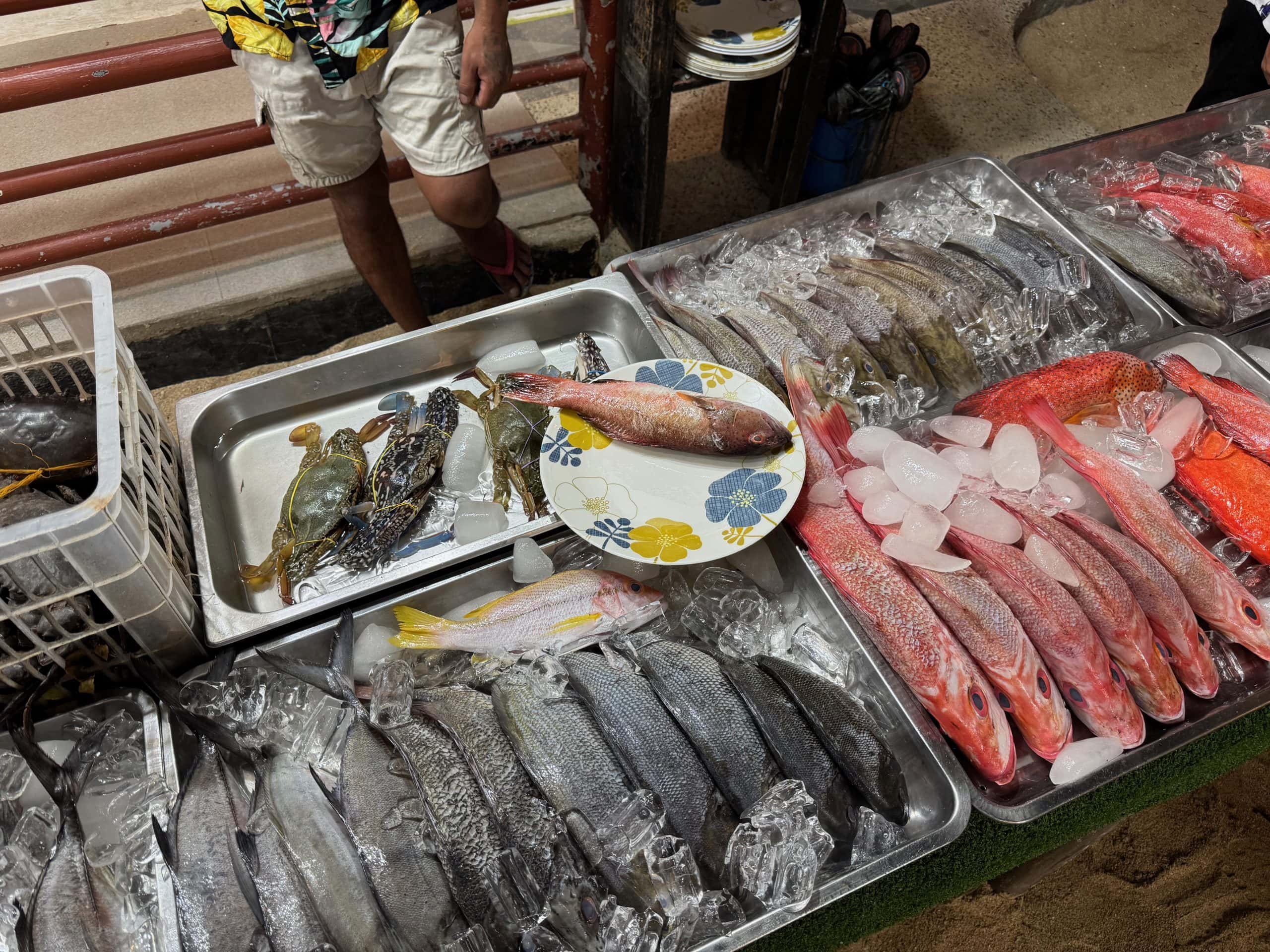 Selection of fresh fish and seafood on ice at a local El Nido market stall, where you can choose your meal and have it cooked on the spot