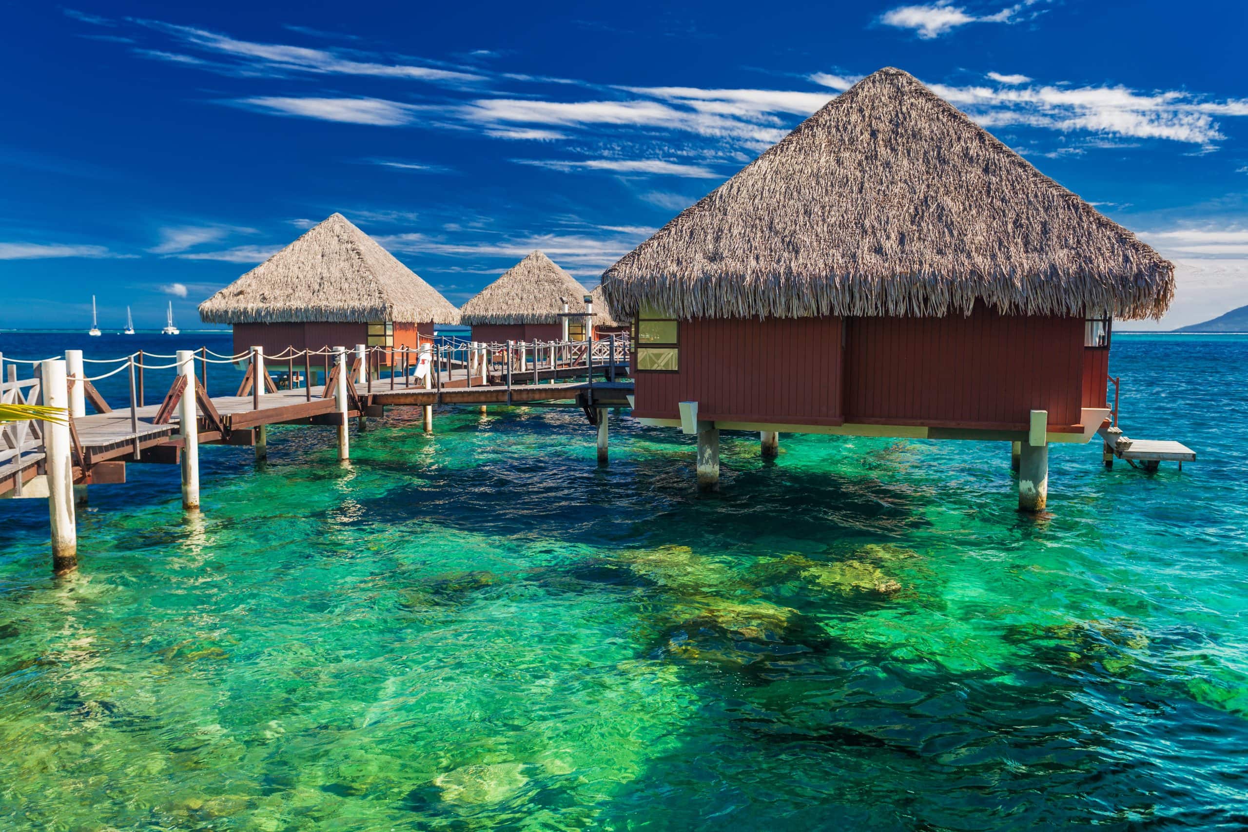 Overwater bungalows above a tropical lagoon in Bora Bora, French Polynesia