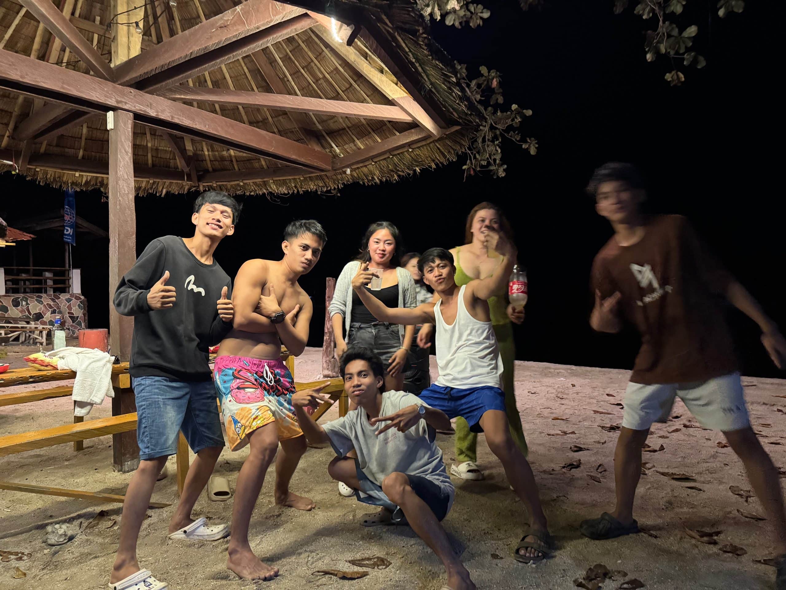 A night out with locals on the beach in the Philippines, capturing the friendly and social side of travelling around the country.