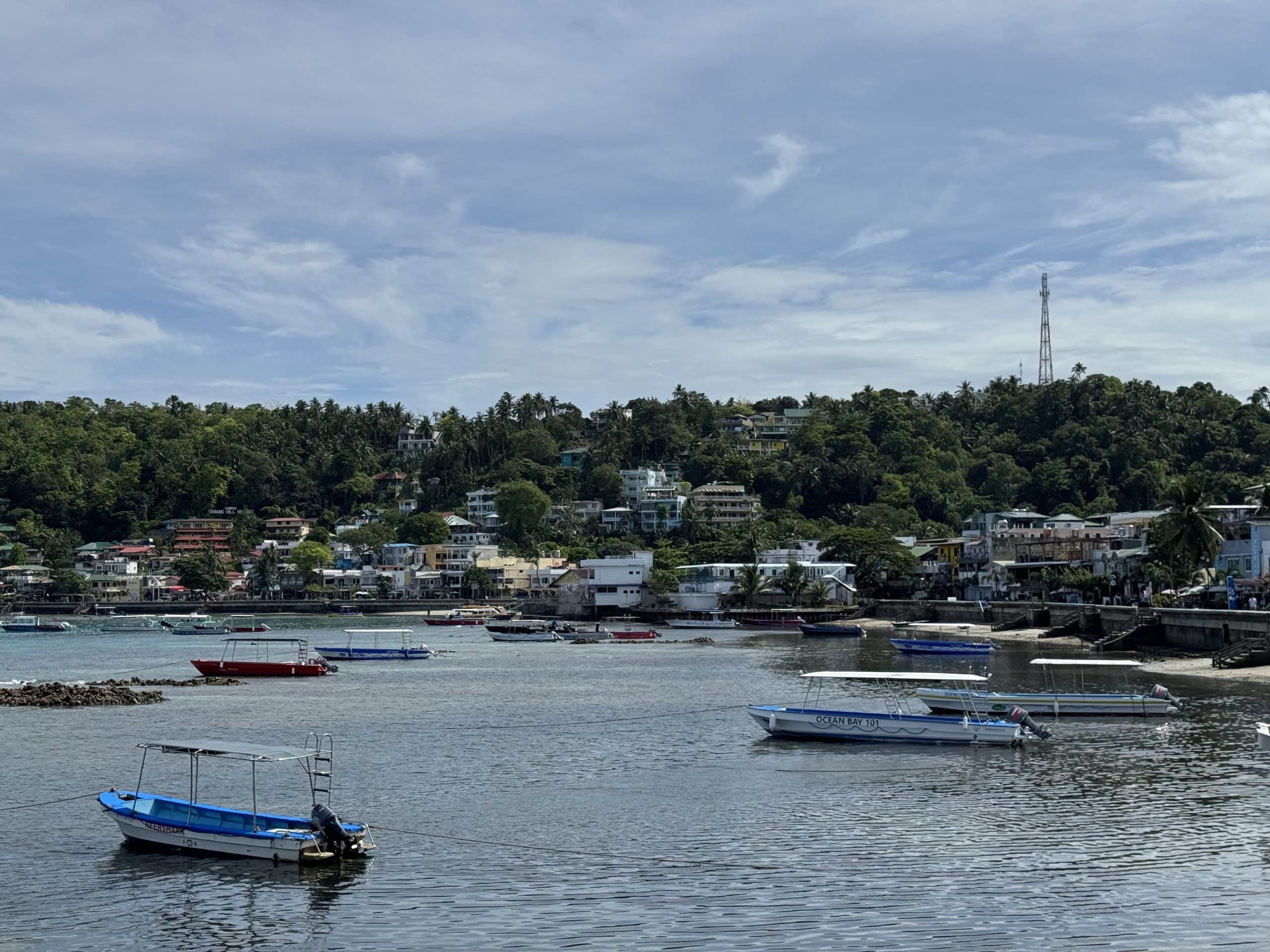 Boats along the waterfront in Puerto Galera, Mindoro, one of the Philippines’ most popular destinations for beaches, diving and island activities.