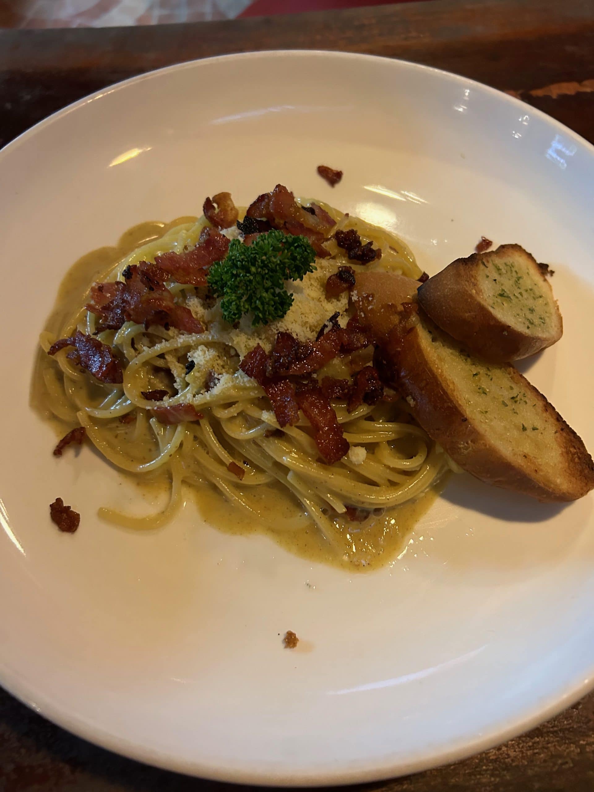 Filipino-style carbonara pasta with bacon, parmesan and garlic bread