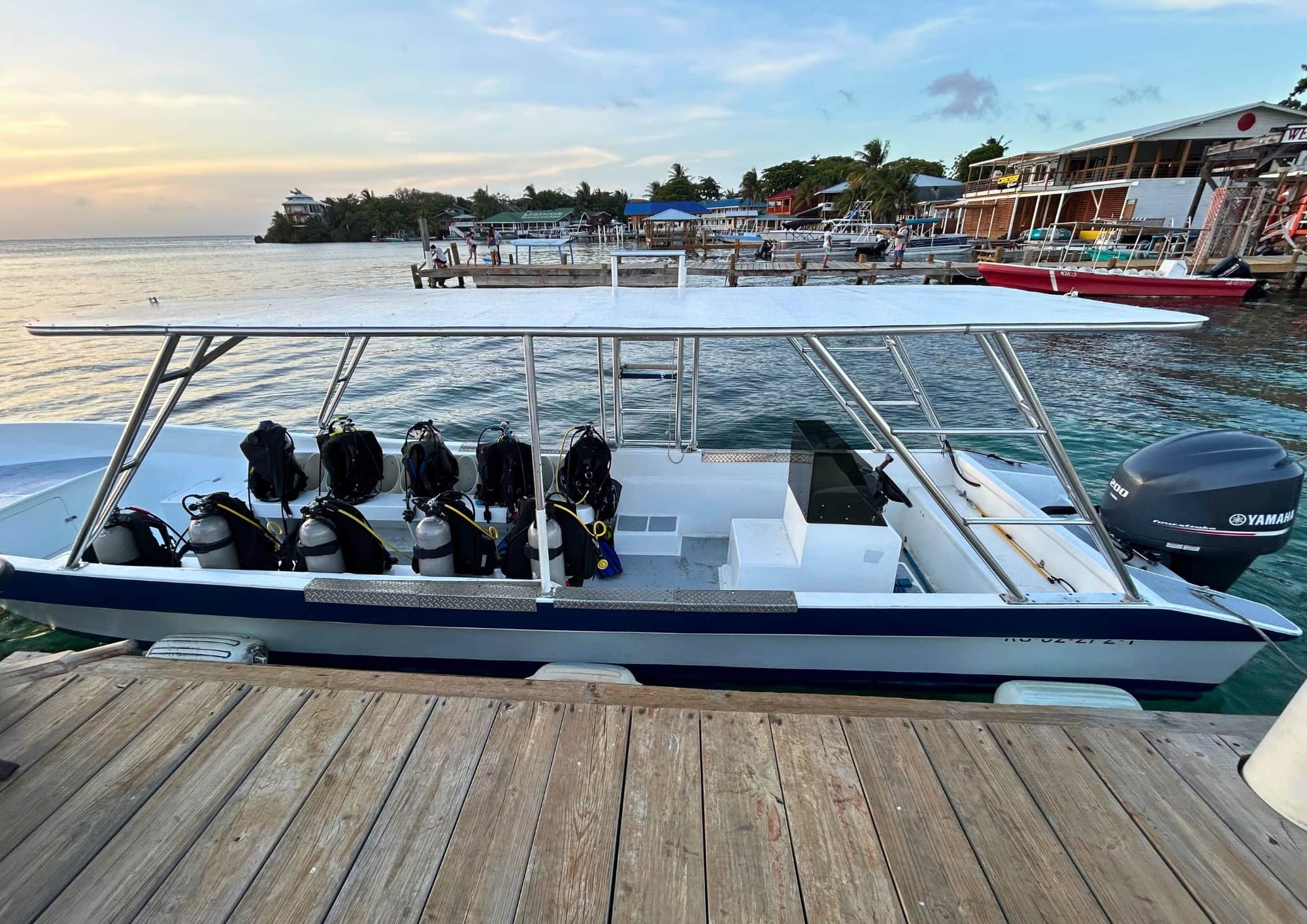 Dive boat ready for departure along the waterfront in West End, Roatán, one of Honduras' top scuba diving destinations.
