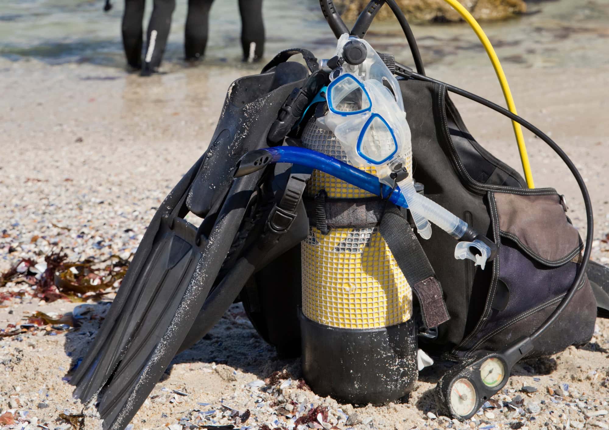 Complete scuba diving gear including BCD, regulator, tank and fins prepared for a dive day.