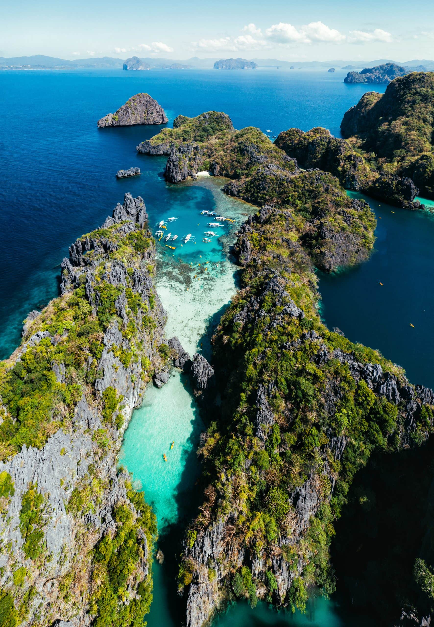 Secret lagoon in El nido. couple enjoying time in the crystal transparent water and kayaking. Concept about traveling and nature